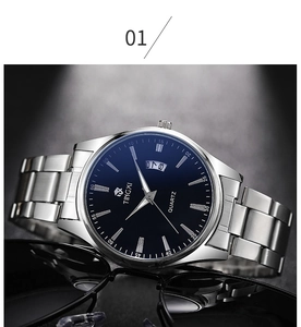 Detailed view of business watch with blue dial, steel strap, and date display feature