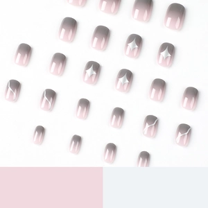 Short gradient press-on nails in pink and grey with silver starburst and line patterns
