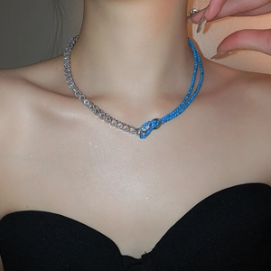 Detail of zircon and pearl necklace with blue beads and faceted crystal stones