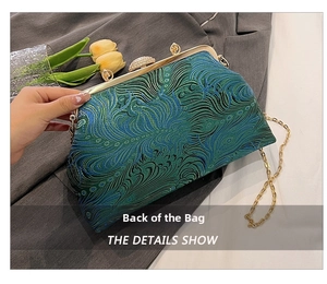 Detailed view of peacock feather embroidery and gold chain strap on vintage clasp bag