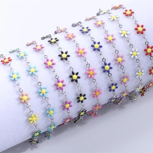 Detailed macro view of colorful 18K gold plated stainless steel daisy chain links