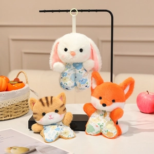 Cute plush animal charms with floral outfits including rabbit, cat and fox dolls