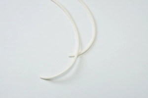Close-up of white woven cotton drawstring detail with high-quality textured finish