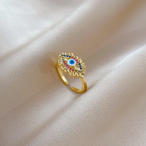 Adjustable Evil Eye open ring with colorful zircon in gold finish on silk background