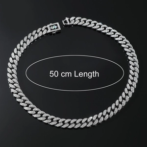Silver iced-out Cuban chain necklace with dollar sign clasp, 50 cm length on black background