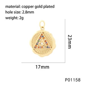Detail of gold-plated copper evil eye pendant with cubic zirconia and size dimensions