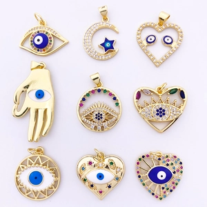 Detailed grid of nine gold evil eye and Hamsa hand pendants with colorful zircon inlay