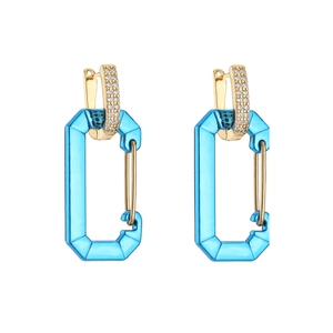 Macro view of blue crystal geometric pendant earrings with micro-paved zircons and gold metal