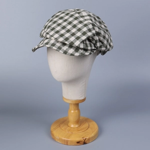 Classic green plaid linen newsboy cap with breathable fabric shown on head form