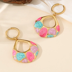 Golden teardrop earrings with pink blue and purple floral enamel on silk background