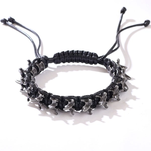 Gothic punk black woven bracelet with silver dragon bone metal spine decoration