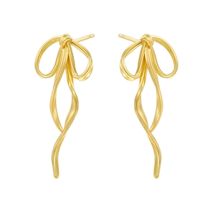 Close-up of golden bow-shaped drop earrings featuring flowing ribbon lines and metallic luster