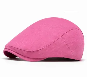 Detail shot of rose red newsboy cap showing cotton linen fabric texture and stitching