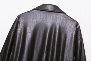 Detailed close-up of vintage faux leather jacket collar with authentic pebbled texture