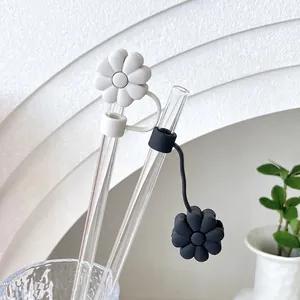 Black and white daisy silicone straw covers for dust protection on glass straws