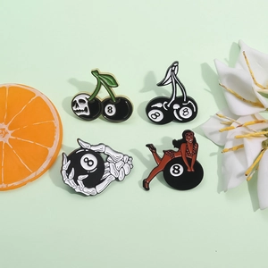 Set of 4 black enamel pins featuring number 8 billiard ball and skull cherry designs