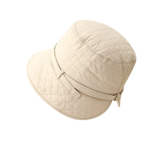 Beige quilted fisherman hat with diamond stitching and adjustable back opening