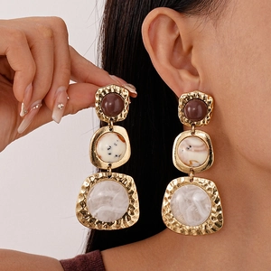 Vintage oversized geometric earrings with hammered gold metal frames and resin stone inlays