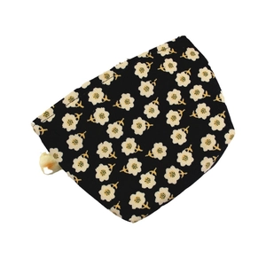 Floral corduroy makeup bag in black with small white flower prints on white background