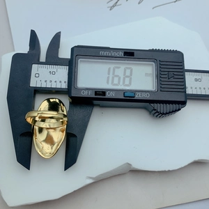 Detailed measurement showing 16.8mm inner diameter of gold floral pearl ring with caliper