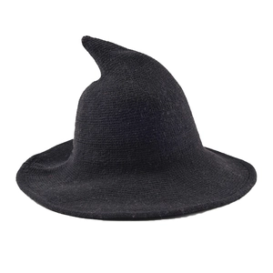 Close-up of the textured knit pattern and wide brim on a black witch style hat