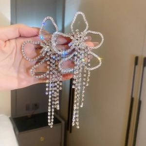 Stunning oversized flower earrings with sparkling rhinestones and long tassel fringe