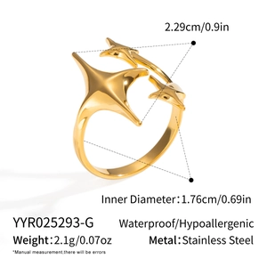 Macro shot of gold star starburst ring showing size parameters and stainless steel texture