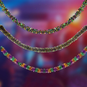 Close-up of fluffy purple green and gold tinsel garlands for carnival party decoration