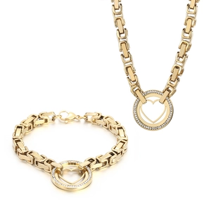 Golden heart jewelry set with necklace and bracelet featuring rhinestone circles