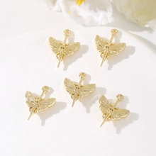Macro detail of five golden butterfly alloy pendants for DIY jewelry crafting