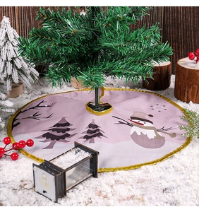 Detail of pink Christmas tree skirt with cartoon snowman print and gold satin trim border
