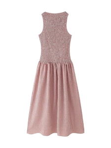 Detail of red and white gingham midi dress with elastic smocking and pleated high waist