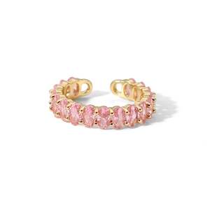 Detail of pink oval-cut zircon cluster on adjustable gold-plated open ring band