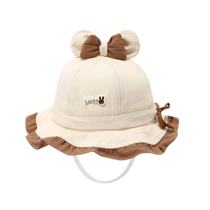 Baby sun hat with rabbit patch, bow accent and 3D ears on cream cotton fisherman cap