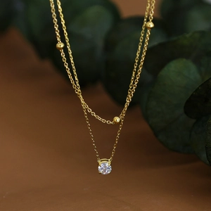 Double-layered 18K gold plated stainless steel necklace with zircon pendant and gold beads