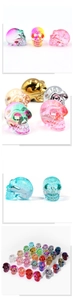 Detailed grid showing colorful electroplated crystal skull statues for Halloween decor