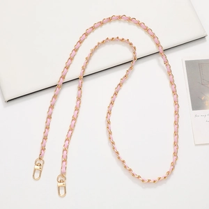Detail of pink leather woven gold metal chain strap with secure lobster clasps