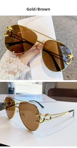 Macro detail of the golden leopard head decoration and brown lenses on aviator sunglasses