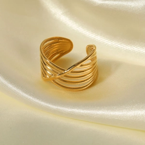 Adjustable multilayer cross-line gold ring in 18K stainless steel on beige silk
