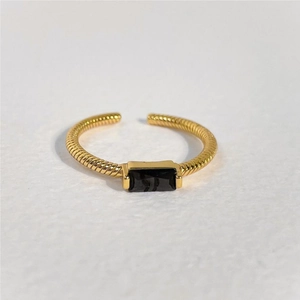 Minimalist gold spiral open ring featuring a rectangular black zircon gemstone