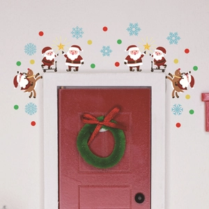 Detail of red miniature Christmas door sticker with Santa, reindeer and green wreath decal