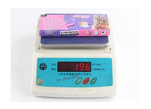 Detail of DIY hair gem refill pack showing Shining Diamond kit weighed on digital scale