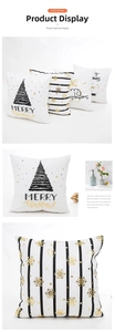Detail of Christmas pillow cover featuring gold foil trees and Merry Christmas text