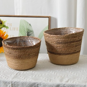Detail of seagrass flower pot with dual-tone weave and waterproof plastic lining