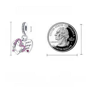 Size details of S925 silver heart charm with zircon and dimensions next to a coin