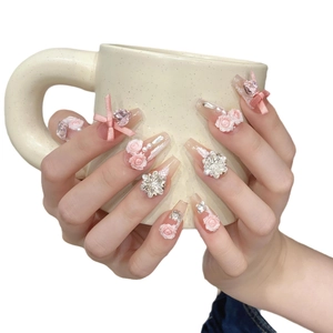 Pink and white 3D floral press-on nails with resin roses and silk bows in long coffin shape