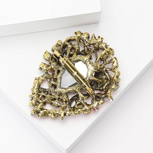 Macro view of vintage gold alloy brooch back with branch texture and pin fastener