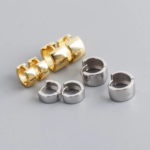 Detail of gold and silver S925 sterling silver hoop earrings in small and large sizes