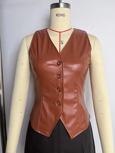 Detail of vintage brown PU leather vest with classic V-neck and four button closure