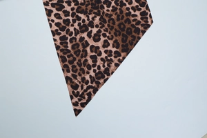 Detailed macro view of classic leopard print fabric with brown and black textile texture